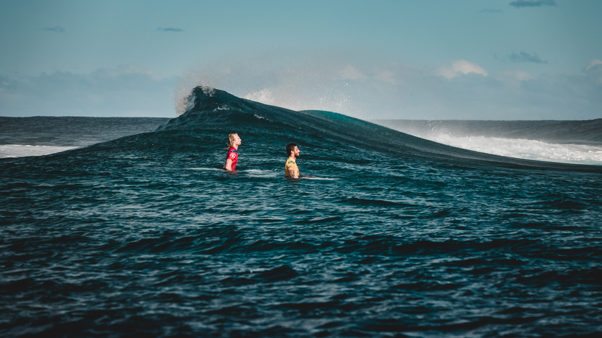 surfers waiting to catch a wave at billabong tahiti pro surf competition