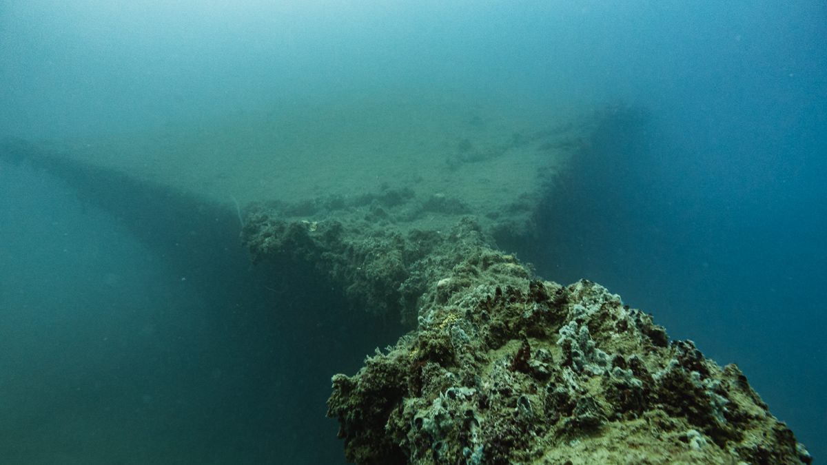 nikki wynn scuba diving a shipwreck in raiatea french polynesia