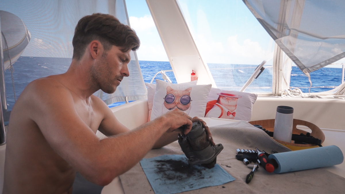 jason wynn working on sailboat engine