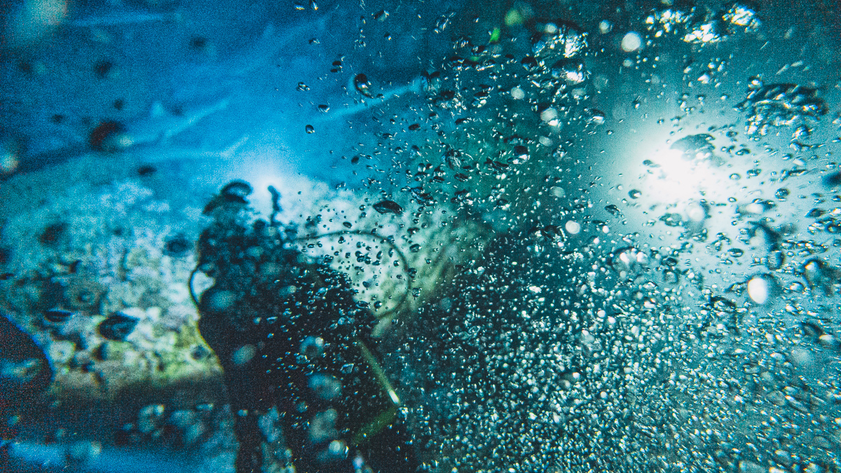 scuba bubbles from night diving in the south pacific