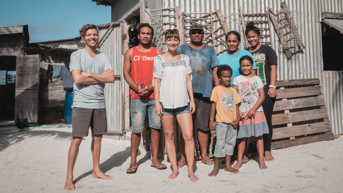 jason and nikki wynn with their host family in palmerston cook islands