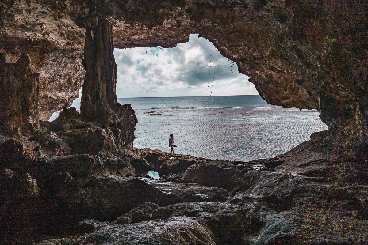 jason wynn photographing a cave in Niue