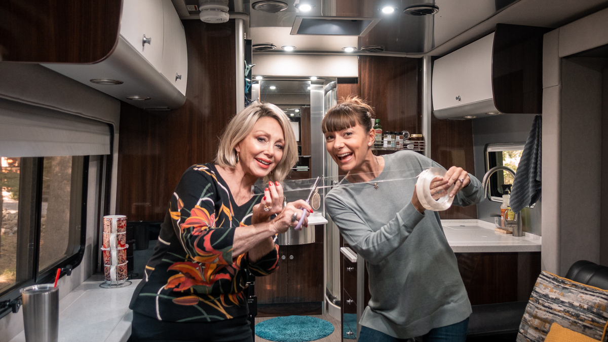 nikki wynn with aunt using silicone tape to secure and organize rv