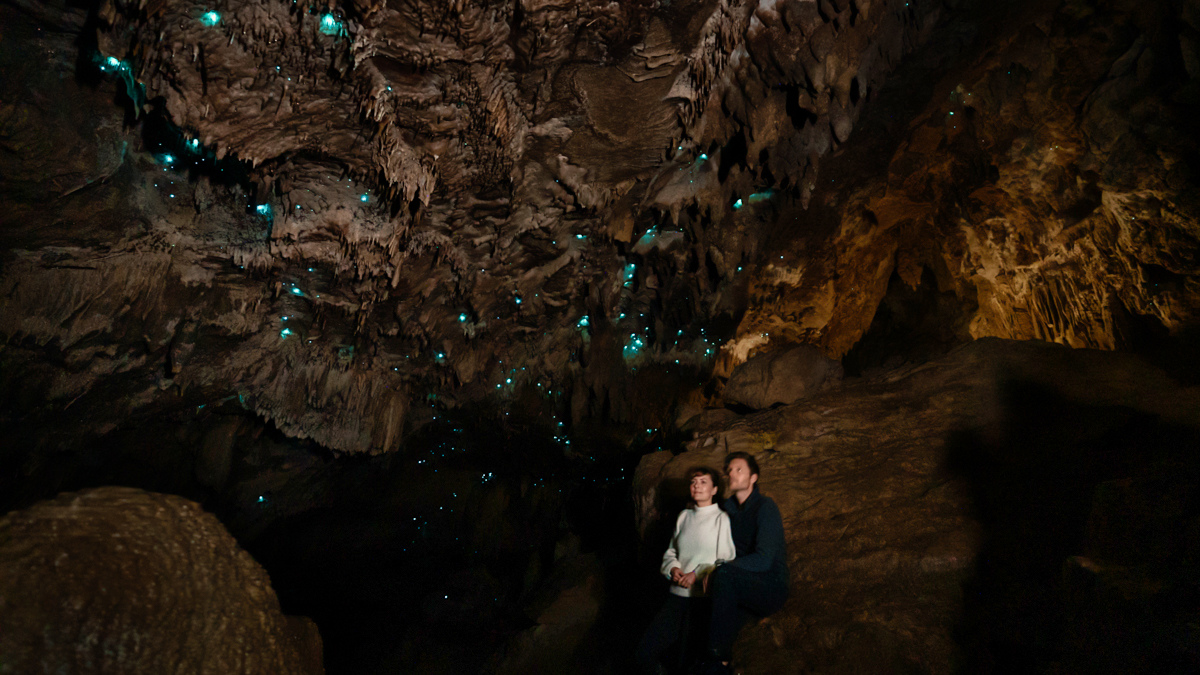 jason and nikki wynn inside glowworm cave new zealand